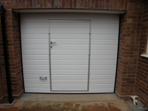 White garage door with door in the middle